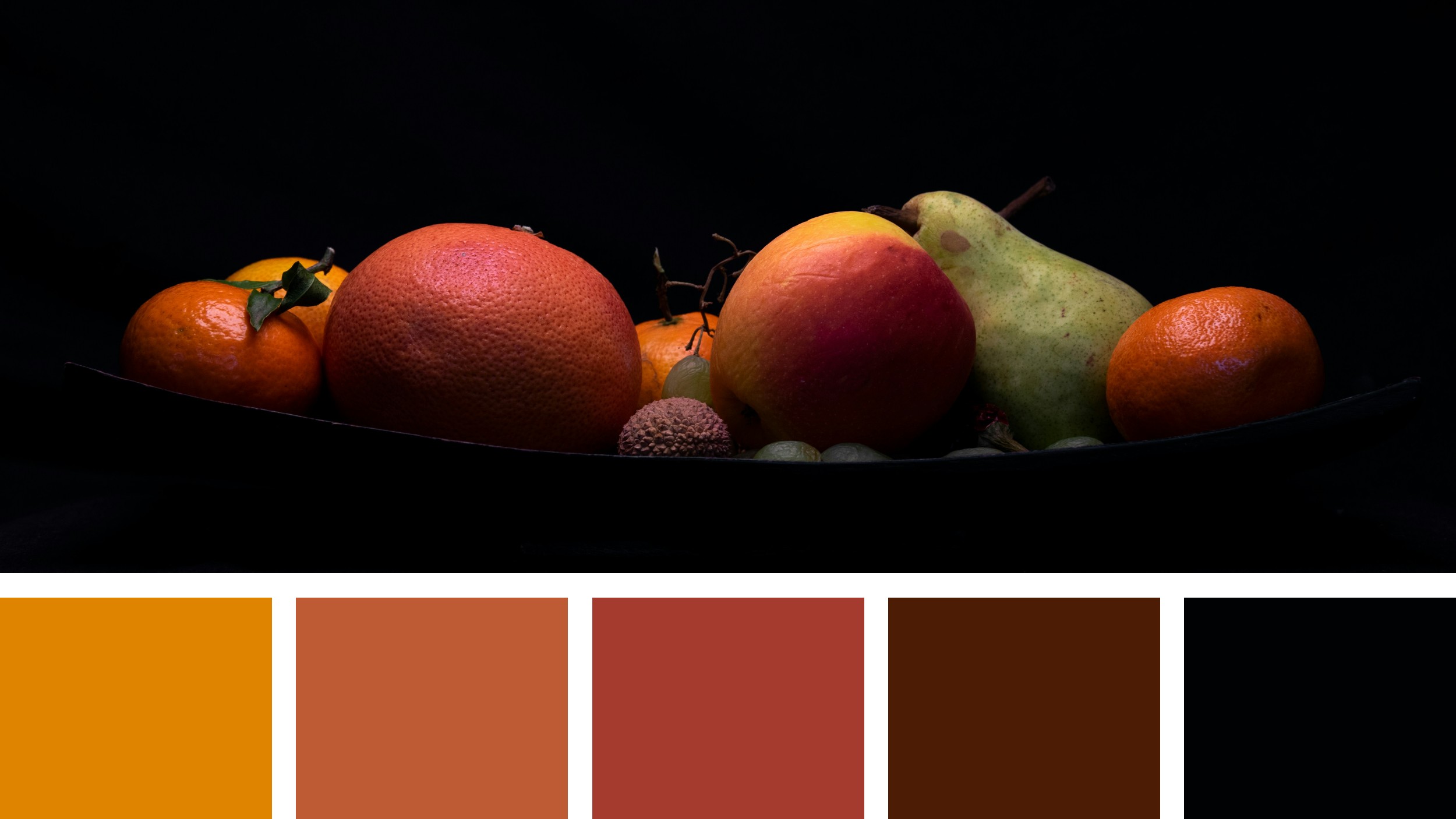 A collection of diverse fruits—oranges, a grapefruit, an apple, and a pear